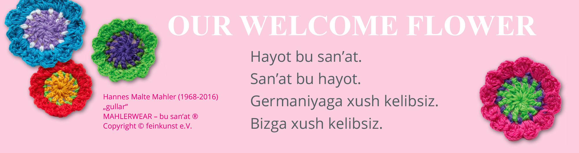 Pushti fonda xush kelibsiz xabari bo'lgan rangli naqshli gullar Germaniyaga tashrif buyuruvchilarni qutlaydi.
